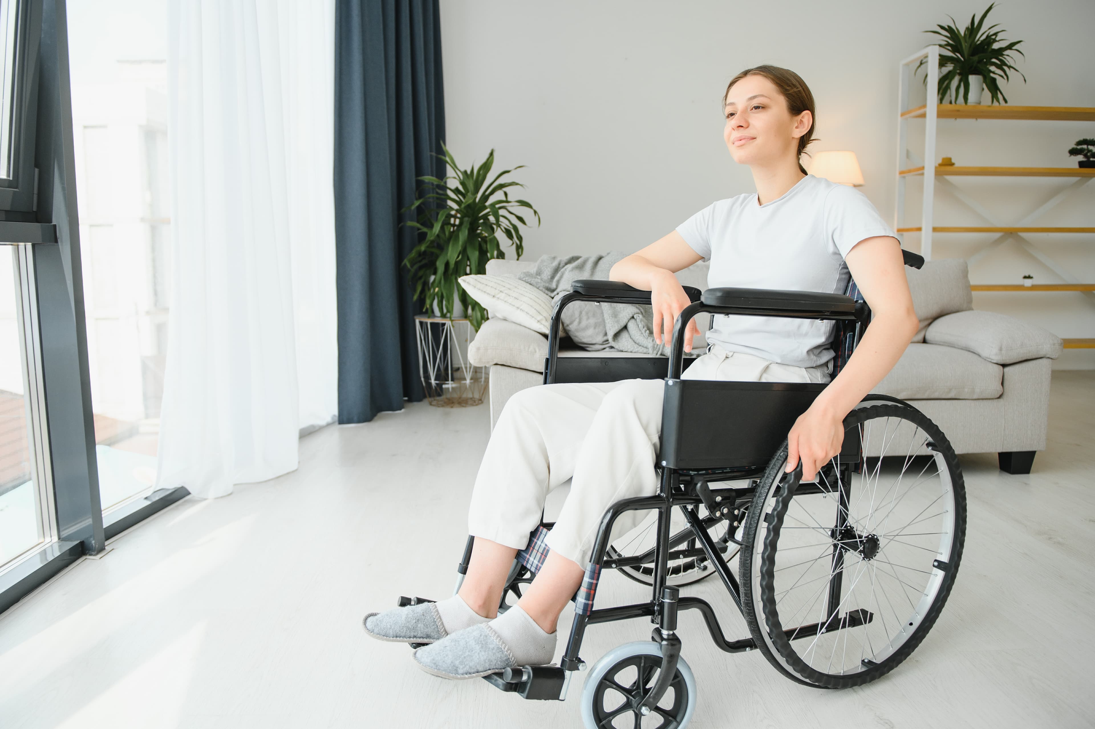 Elderly woman smiling in wheelchair